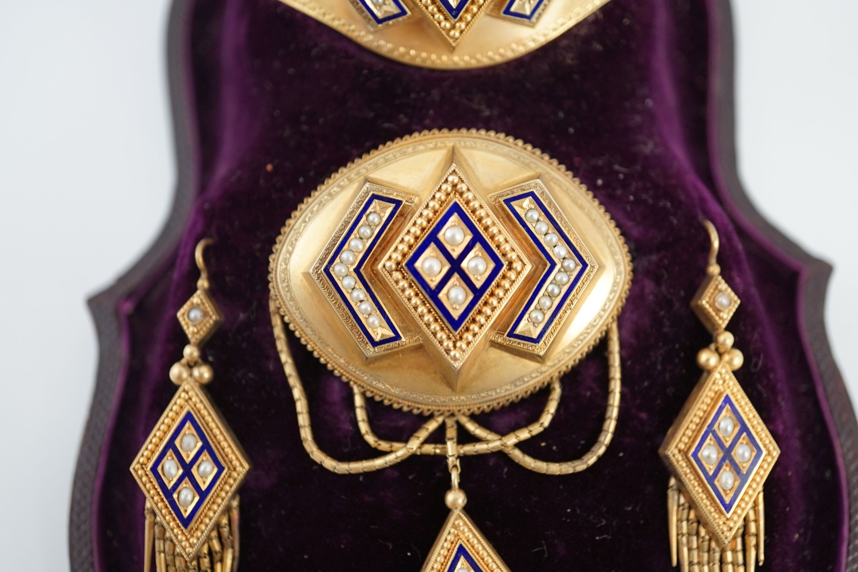 A cased Victorian gold, seed pearl and blue enamel parure